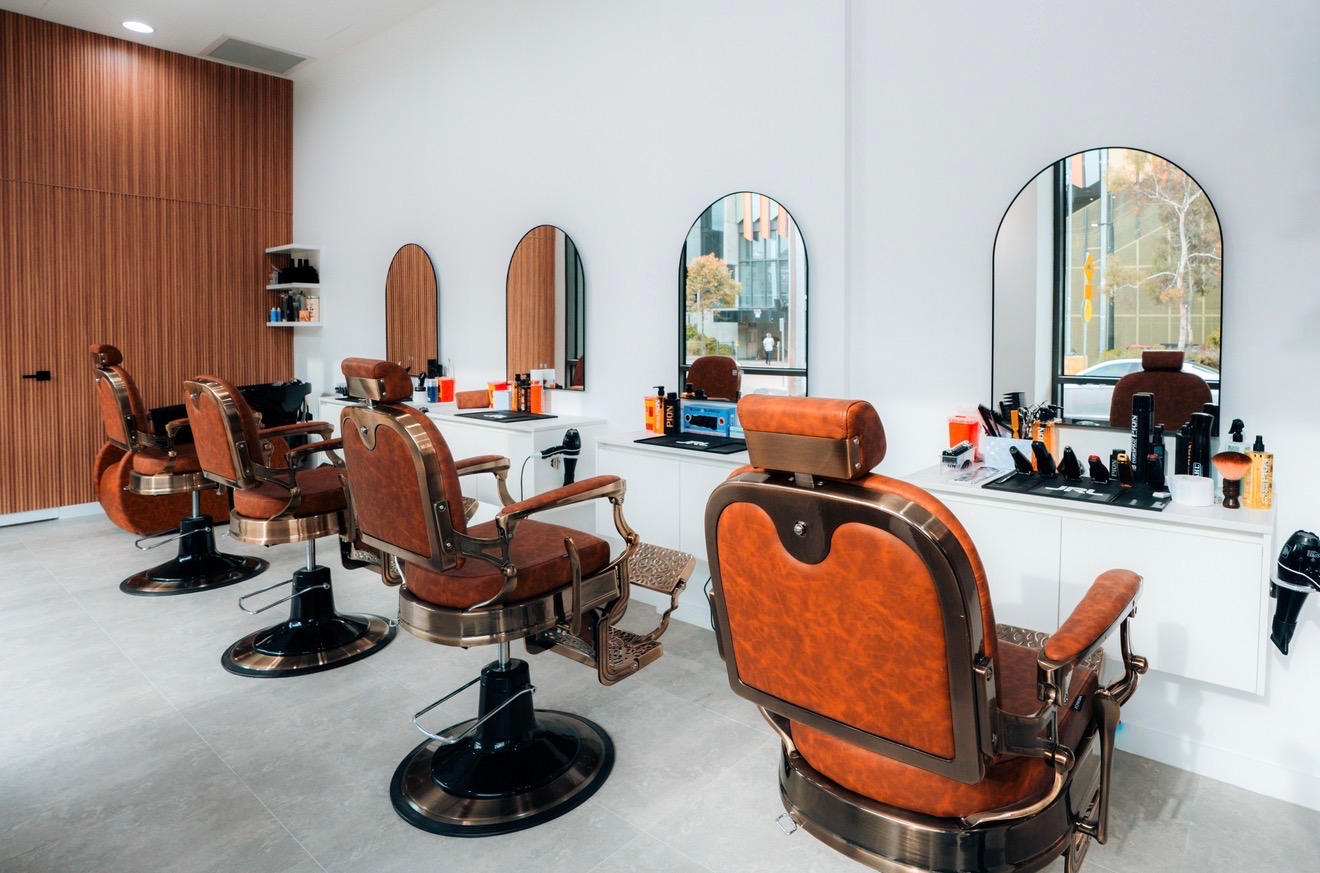 Row of classic barber chairs inside Legacy Barbers