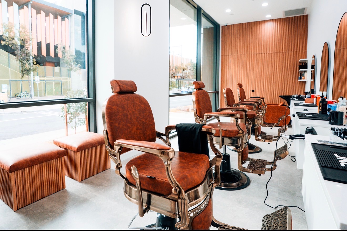 Modern barber shop interior with timber finishes and natural light